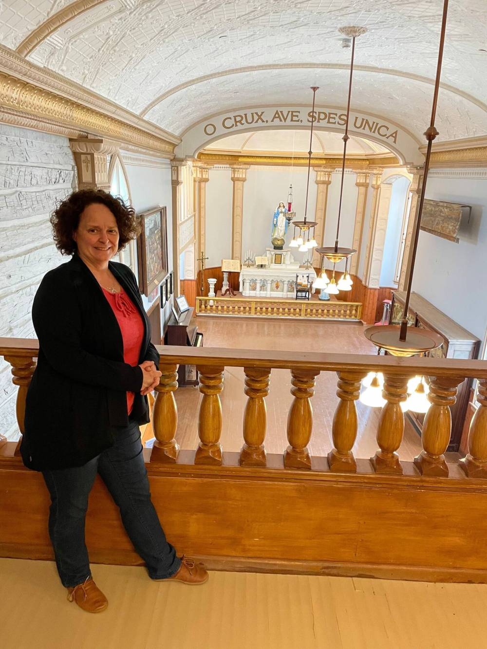 File photo Simon Fuller
St. Boniface Museum’s executive director Cindy Desrochers is pictured in the museum, with its chapel in the background, in a June 2024 file photo before it was closed for extensive renovations.