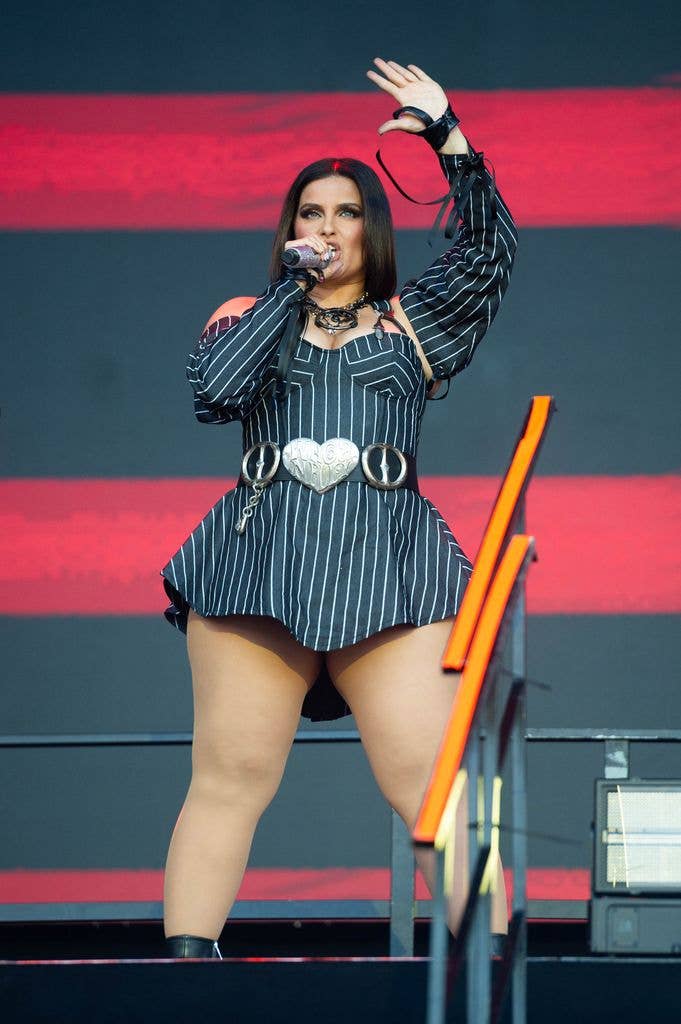photo of nelly furtado in short dress on stage in germany