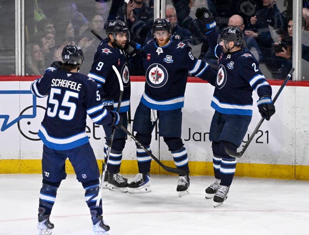 FRED GREENSLADE / THE CANADIAN PRESS FILES
The Winnipeg Jets 4-0-2 streak since the Olympic break has pulled the club within five points of the final wild-card berth. Defenceman Dylan DeMelo (right) says the break helped the group recharge.