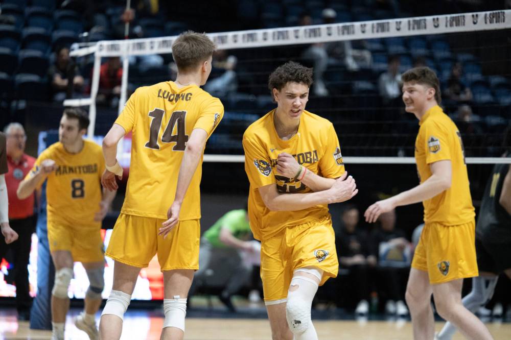 MIKE STILL / BISONS ATHLETICS
Owen Weekes of the University of Manitoba Bisons celebrates one of his six service aces against the Laval Rouge et Or in the USports men's volleyball championship in Windsor, Ont., on Friday.