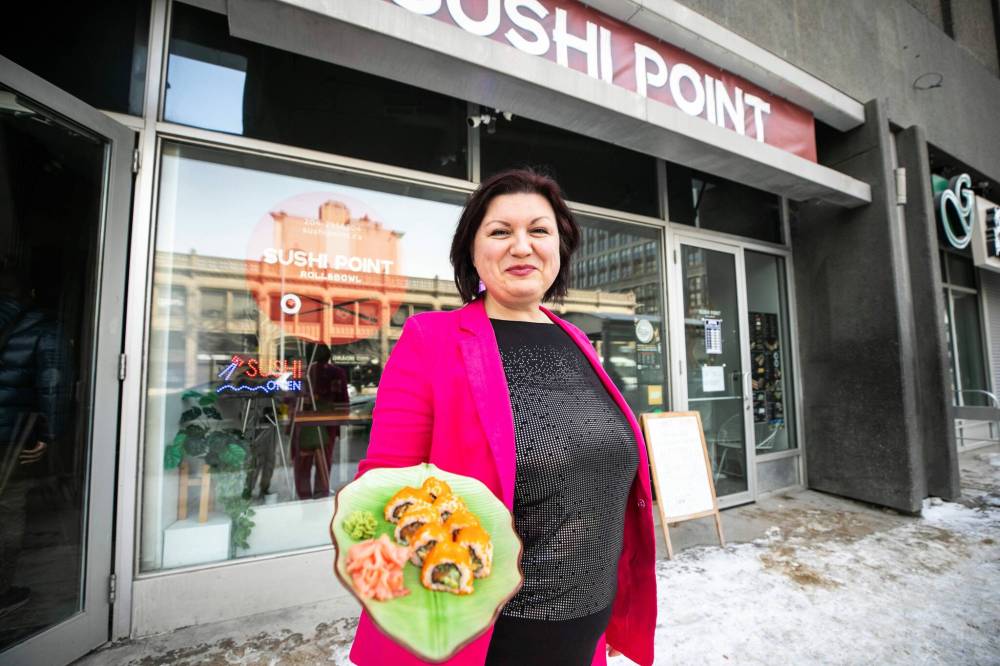 MIKAELA MACKENZIE / FREE PRESS
Sushi Point owner Olha Vovkotrub outside her restaurant at 238 Portage Ave. The eatery is listed on a new community project that features 138 local businesses, all operated by Ukrainians.