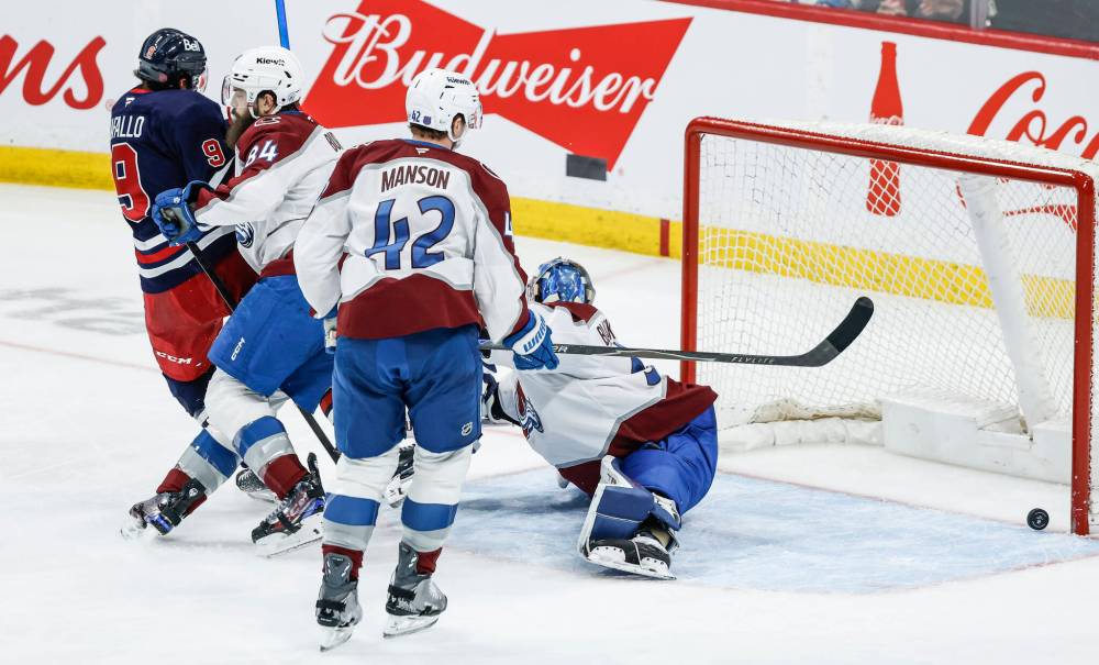 JOHN WOODS / THE CANADIAN PRESS
Winnipeg Jets’ Alex Iafallo (9) scores on Colorado Avalanche goaltender Mackenzie Blackwood (39) during second period action in Winnipeg on Saturday.