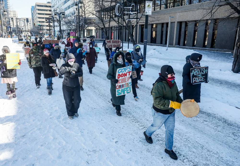 JOHN WOODS / FREE PRESS
While marching downtown, protesters stopped outside of the Canada Life Centre, where a Winnipeg Jets game was underway, before ending the march at the Magnus Eliason Recreation Centre.