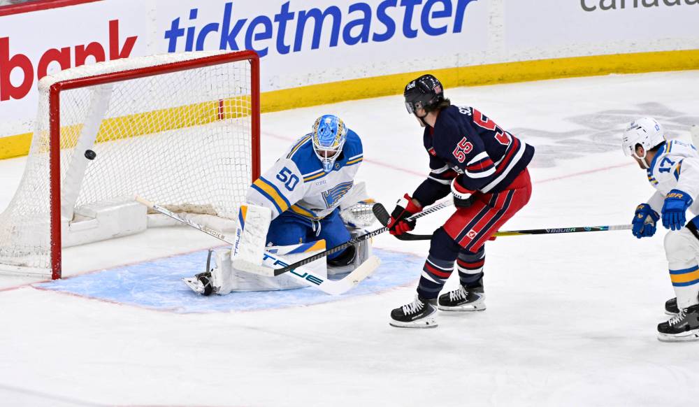 FRED GREENSLADE / THE CANADIAN PRESS
Winnipeg Jets’ Mark Scheifele (55) scores on St. Louis Blues goaltender Jordan Binnington (50) during the first period in Winnipeg on Sunday.