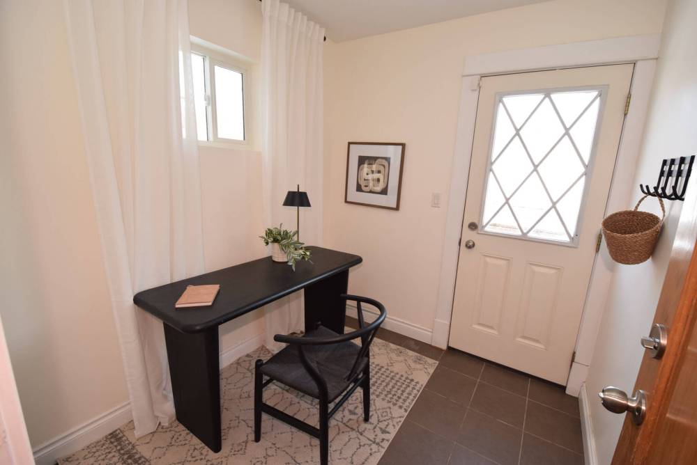 TODD LEWYS / FREE PRESS
Located at the rear of the home, a tiled mudroom is a handy, family-friendly space that also has a rear door leading out to a deck and fenced backyard.