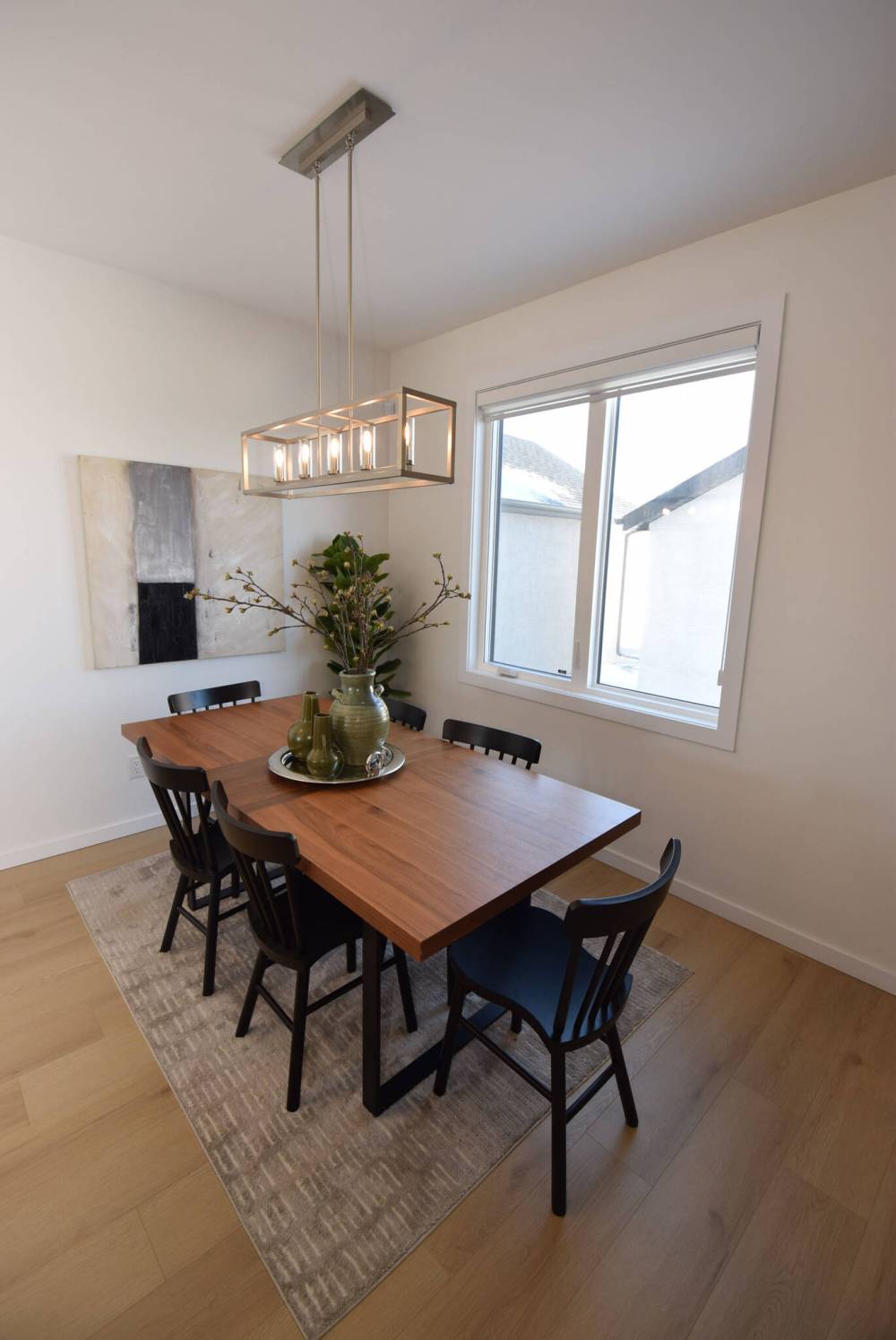 TODD LEWYS / FREE PRESS
The dining area, which is set beneath a mod chandelier and next to a huge window, can seat anywhere from six to 10 guests.