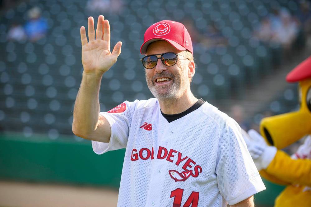 MIKE SUDOMA/FREE PRESS Files
Actor Bob Odenkirk waves prior to throwing one of the two first pitches to open the Winnipeg Goldeyes game in August 2024.