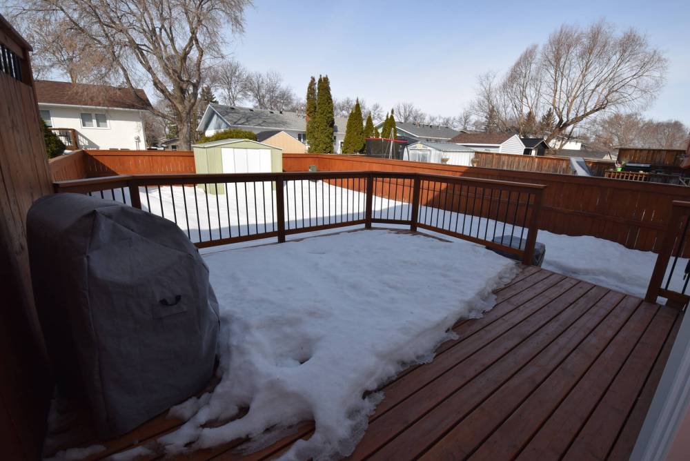 Step out back and there’s a big deck ready for entertaining, chilling out or watching the kids play.