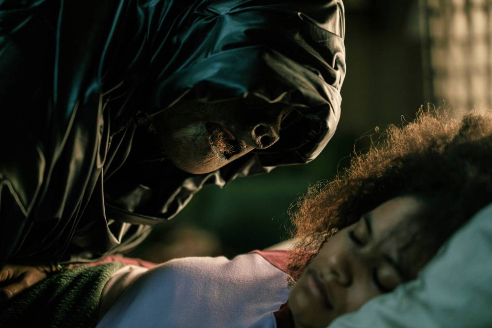 Warner Bros. Pictures via AP
Asia (Zazie Beetz) gets a creepy visitor in a scene from They Will Kill You.