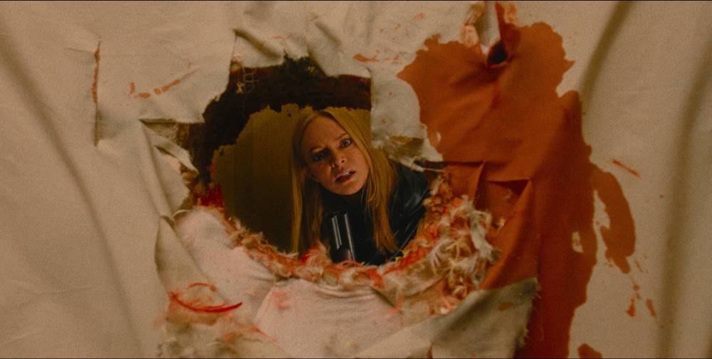 Warner Bros. Pictures via AP
Heather Graham plays one of the awful one-percenter residents of the apartment building The Virgil in a scene from They Will Kill You.