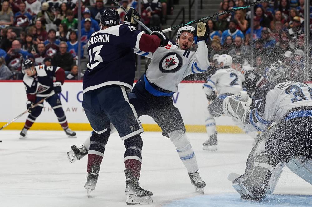 DAVID ZALUBOWSKI / THE ASSOCIATED PRESS
Colorado Avalanche right wing Valeri Nichushkin, left, checks Winnipeg Jets defenceman Josh Morrissey as he crashes the net in the third period Saturday in Denver.