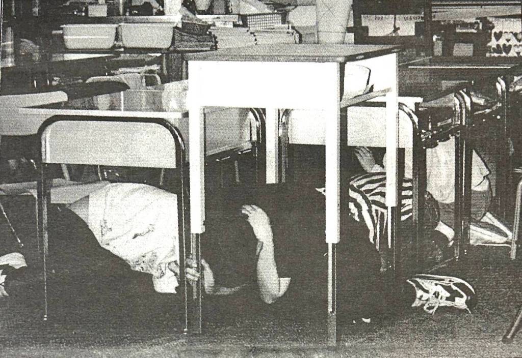 &ldquo;Earthquake drill: Students in Honeymoon Bay Elementary School hide under their desks, Wednesday morning, moments after the earthquake struck. The drill is standard procedure in the event of an earthquake. Many in the school, including these students, didn&rsquo;t feel the earthquake, while others did.&rdquo; (Lake Cowichan Gazette, (March 7, 2001)