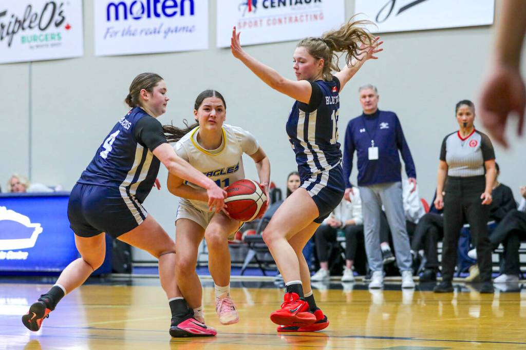 M.E.I. Eagles (in white) played Charles Best Blue Devils at Langley Events Centre on Thursday, Feb. 26, 2026. Abbotsford&rsquo;s Eagles won 73-66. (Contributed/Vancouver Sports Pictures)