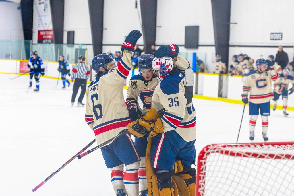 Cloverdale HC players celebrate a victory over the Abbotsford Pilots Feb.22 at The Barn. The win gave Cloverdale a 3-1 lead in the series. The expansion squad went on to win the series, it&rsquo;s first on franchise history, 4-2. Now they face the White Rock Whalers in the second round of the PJHL playoffs. (Photo: Jason Sveinson/Cloverdale Reporter)