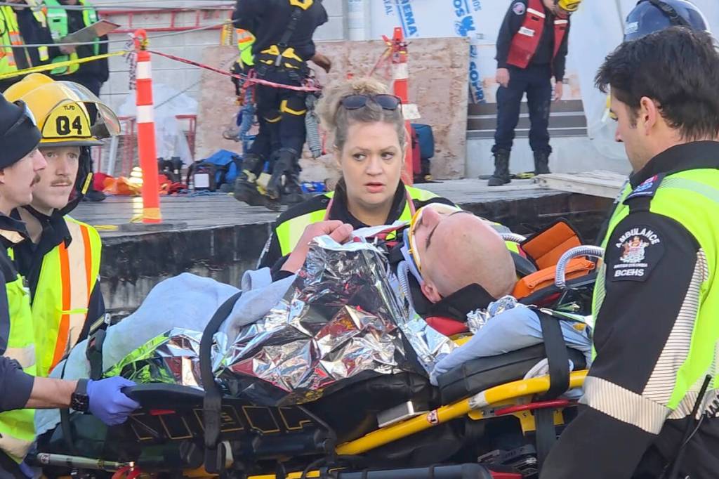 First responders pulled a man from the trench just before 9:30 a.m. on Monday, March 2 at the Langley Events Centre construction site. (Dan Ferguson/Langley Advance Times)