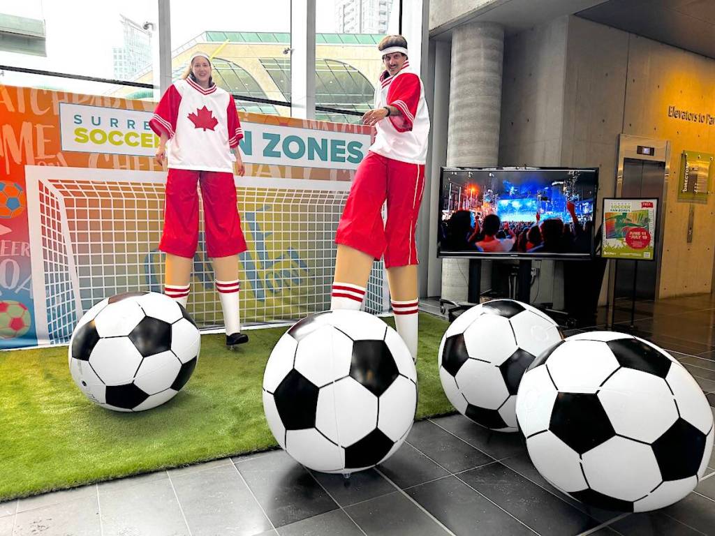 Stilt-walkers play soccer at Surrey City Hall during a launch event for Surrey Soccer Fan Zones planned during the FIFA World Cup soccer tournament in June and July 2026. (Tom Zillich/Surrey Now-Leader photo)