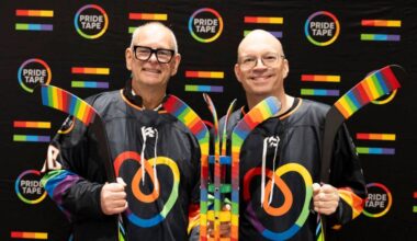 MP Ernie Klassen, left, and Senator Kristopher Wells pose for a photo with the NHL Unites Pride Cup during the NHL Unites Pride Cup at North Surrey Sport & Ice Complex on Saturday, Feb. 28, 2026. Klassen and Wells are co-chairs of the Canadian Parliamentary Pride Caucus. Wells is also one of the co-founders of Pride tape alongside Jeff McLean. (Anna Burns/ Surrey Now-Leader)