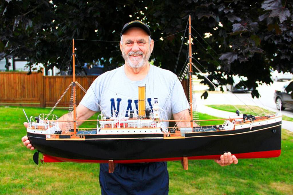 Yvon Lehoux holds a model of the SS Komagata Maru. A neighbour commissioned him to build to the ship. (Photo: Malin Jordan/Cloverdale Reporter)