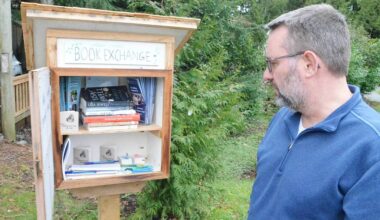 Langley Hospice volunteer Steve Scheepmaker built the new little free library that stands outside the organization&rsquo;s City headquarters. (Matthew Claxton/Langley Advance Times)