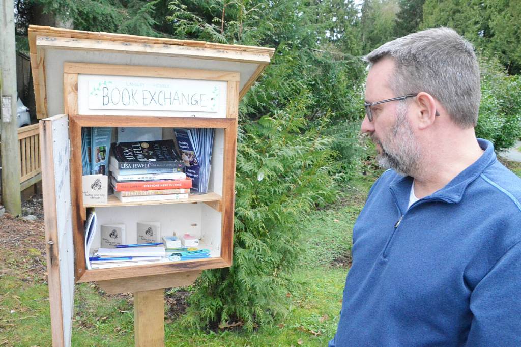 Langley Hospice volunteer Steve Scheepmaker built the new little free library that stands outside the organization&rsquo;s City headquarters. (Matthew Claxton/Langley Advance Times)