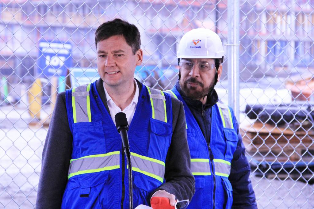 B.C. premier David Eby, flanked by Surrey-Fleetwood MLA Jagrup Brar, gives remarks about the construction progress on the new Cloverdale hospital March 6. Eby was in Surrey to mark the &ldquo;halfway milestone,&rdquo; as he said, of the construction phase of the hospital building. (Photo: Malin Jordan/Cloverdale Reporter)