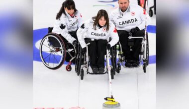 Spallumcheen&rsquo;s Ina Forrest (centre) delivers a rock while Canadian teammates Callinda Joseph (left) and Jon Thurston steady her chair during a preliminary round game at the 2026 Milano Cortina Paralympics in Italy. Canada has secured a spot in the semifinals Friday, March 13. (Angela Burger - Canadian Paralympics Committee)