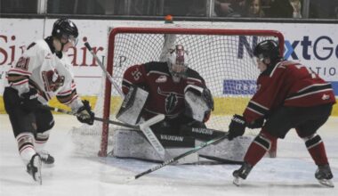 Red Deer Rebels goaltender makes a stop during a game against the Calgary Hitmen at the Marchant Crane Centrium on Saturday, March 14. (Photo by Sean McIntosh/Advocate staff)