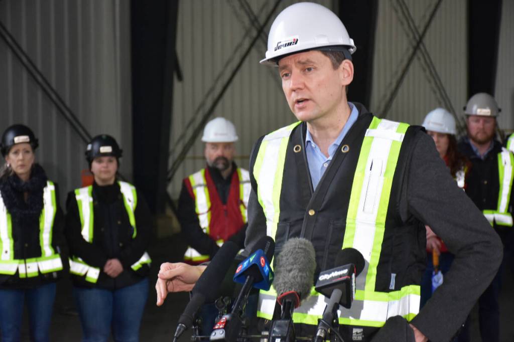 Premier David Eby takes questions from the media during a stop at an industrial site under construction in Maple Ridge. (Neil Corbett/The News)