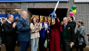 MP Elizabeth May holds the ceremonial scissors in the air after cutting the ribbon to open the Salvation Army store on March 19. (Tony Trozzo/Peninsula News Review)