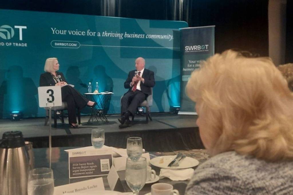 Surrey Mayor Brenda Locke listening to B.C. Transportation Minister Mike Farnworth and Surrey & White Rock Board of Trade CEO Josylyn Young discuss local transportation issues at a luncheon in Guildford on Wednesday. (Tom Zytaruk/Surrey Now-Leader)