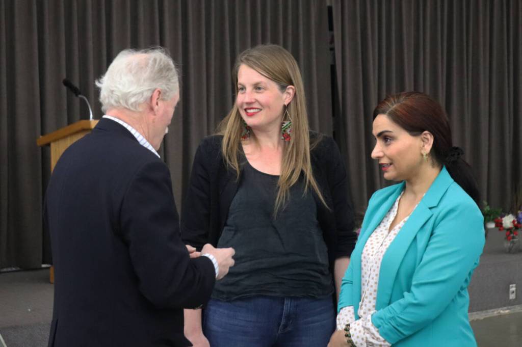 Housing and Municipal Affairs Minister Christine Boyle talks with Vernon Mayor Victor Cumming alongside Vernon-Lumby MLA Harwinder Sandhu at an event in Vernon Saturday, March 21, 2026. (Brendan Shykora/Morning Star)