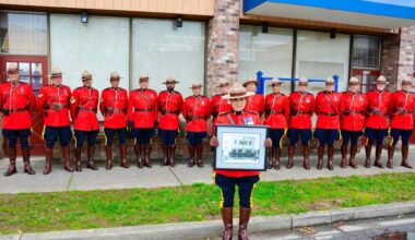 Current members of the RCMP Surrey Provincial Operations Support Unit replicate the original photo (held by Wendy Mehat) that was taken 75 years ago in May, 1951, when the RCMP first took over policing in the Surrey community of Cloverdale. (Photo submitted: RCMP)