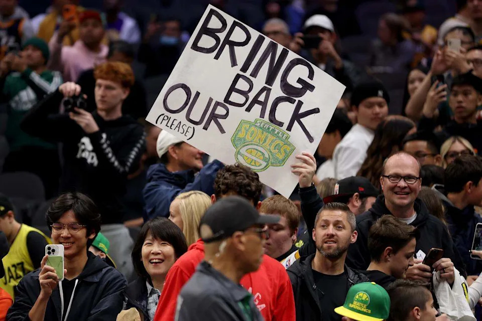 A fan of the old Seattle SuperSonics holds a sign before the Rain City Showcase NBA preseason game between the Los Angeles Clippers and the Utah Jazz at Climate Pledge Arena in Seattle on October 10, 2023. (Photo by Steph Chambers/Getty Images)