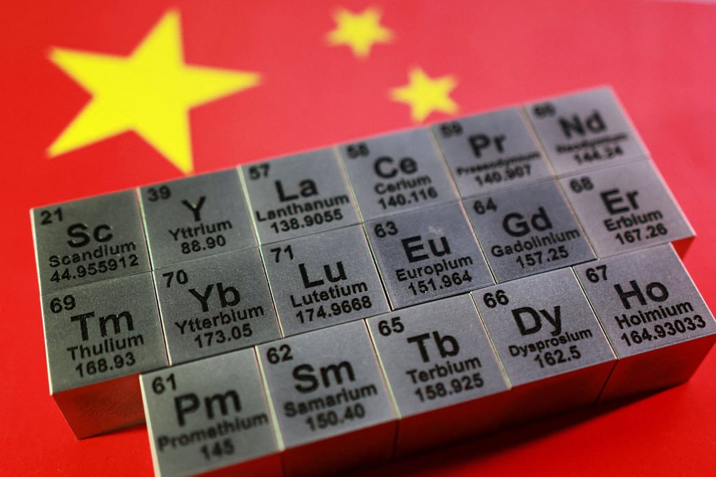 Blocks with symbols and atomic numbers of rare earth elements seen against a Chinese flag. Photo: Reuters