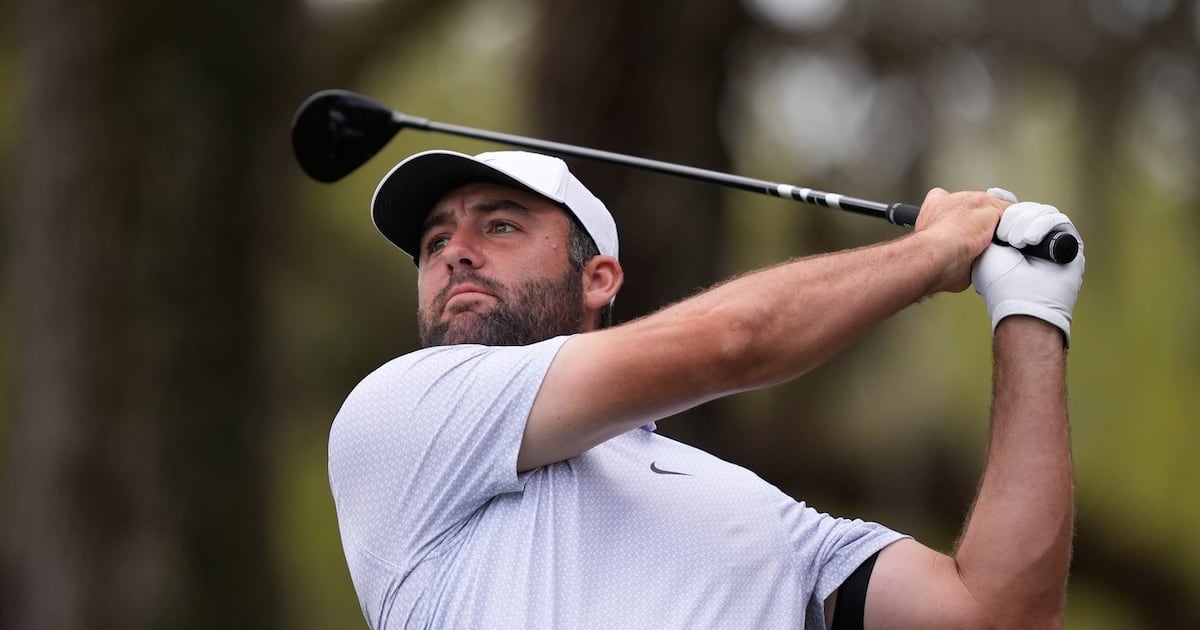 Scottie Scheffler struggles off the tee and spends time in the rain at The Players Championship
