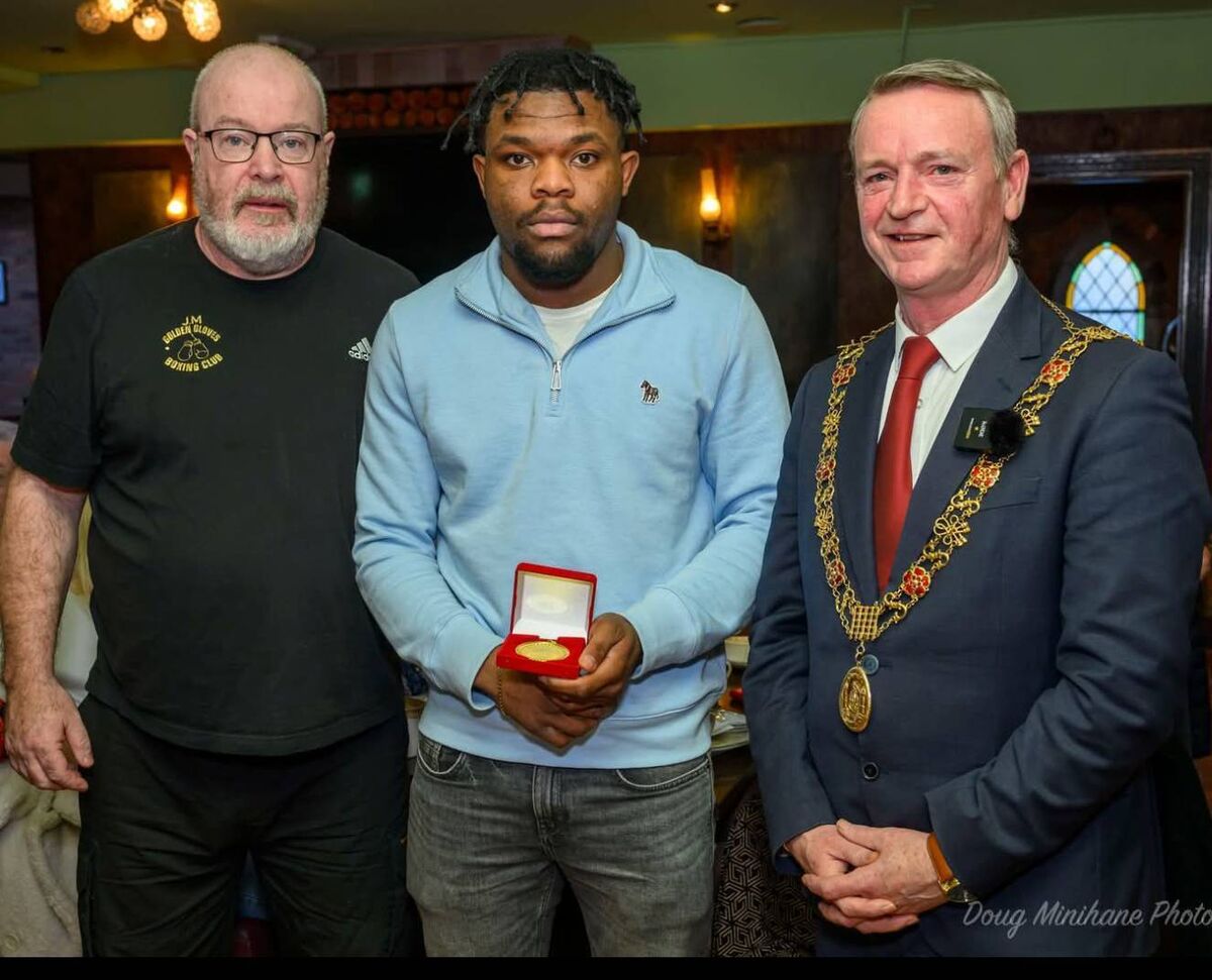 Golden Gloves Boxing Club head coach John Morrissey with his boxer, Ola Wahib, and Cork Lord Mayor Cllr Fergal Dennehy. 