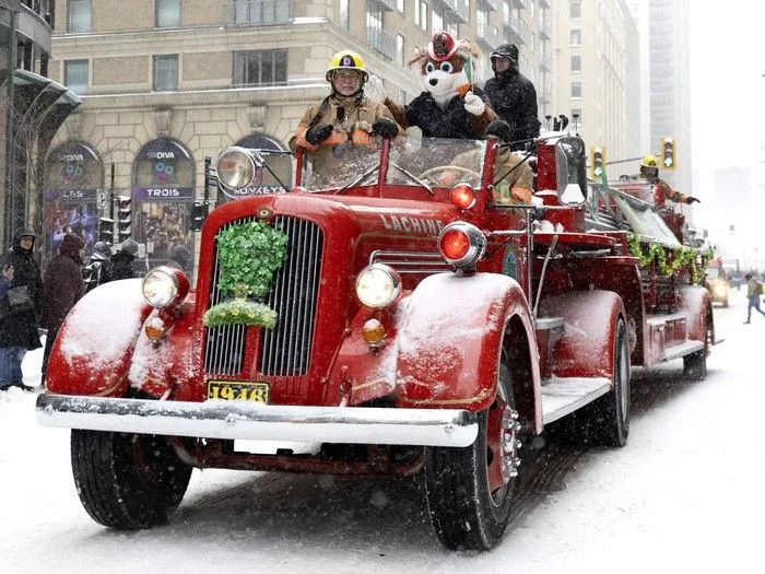  Firefighters drive a 1946 fire truck during the St. Patrick’s Parade in Montreal on Sunday, March 22, 2026.