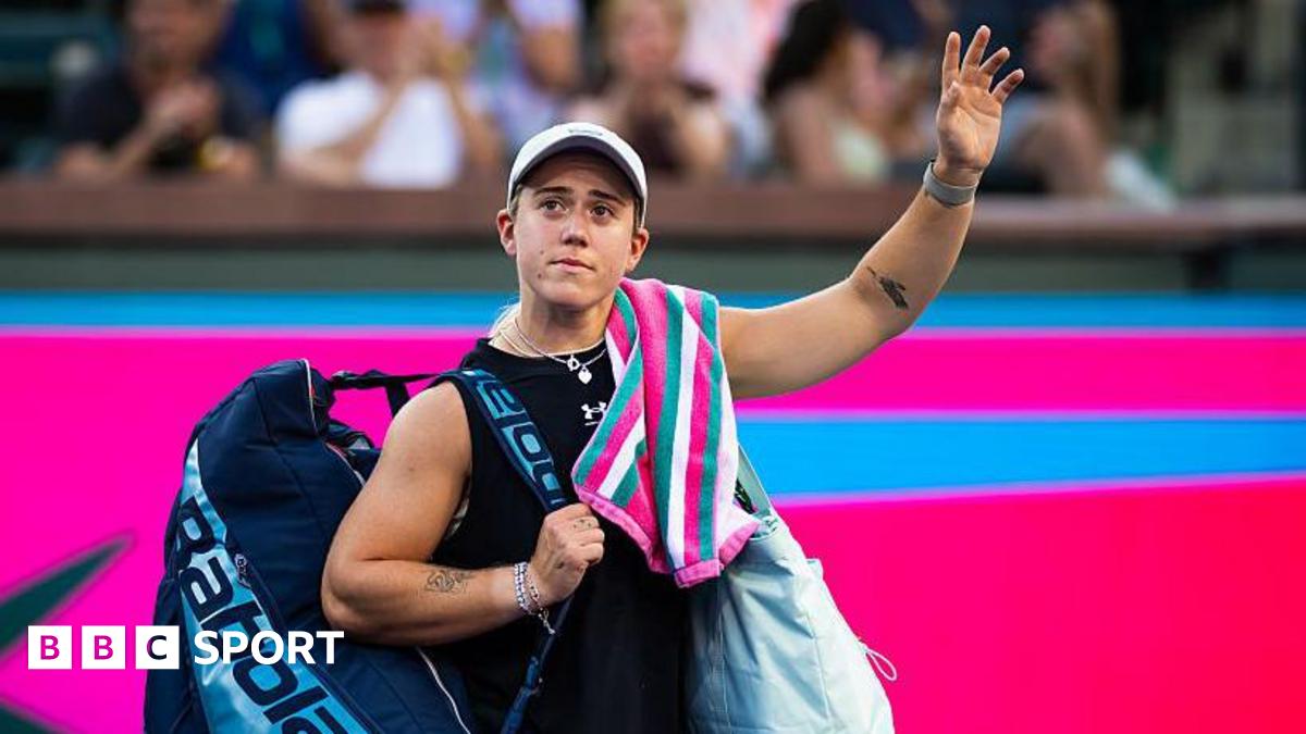 Sonay Kartal waves her left arm towards the crowd as she leaves the court at Indian Wells.