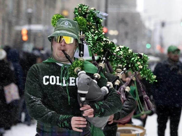  The Ottawa Caledonian Pipes and Drums dress for the occasion as they take part in the St. Patrick’s Parade in Montreal on Sunday, March 22, 2026.