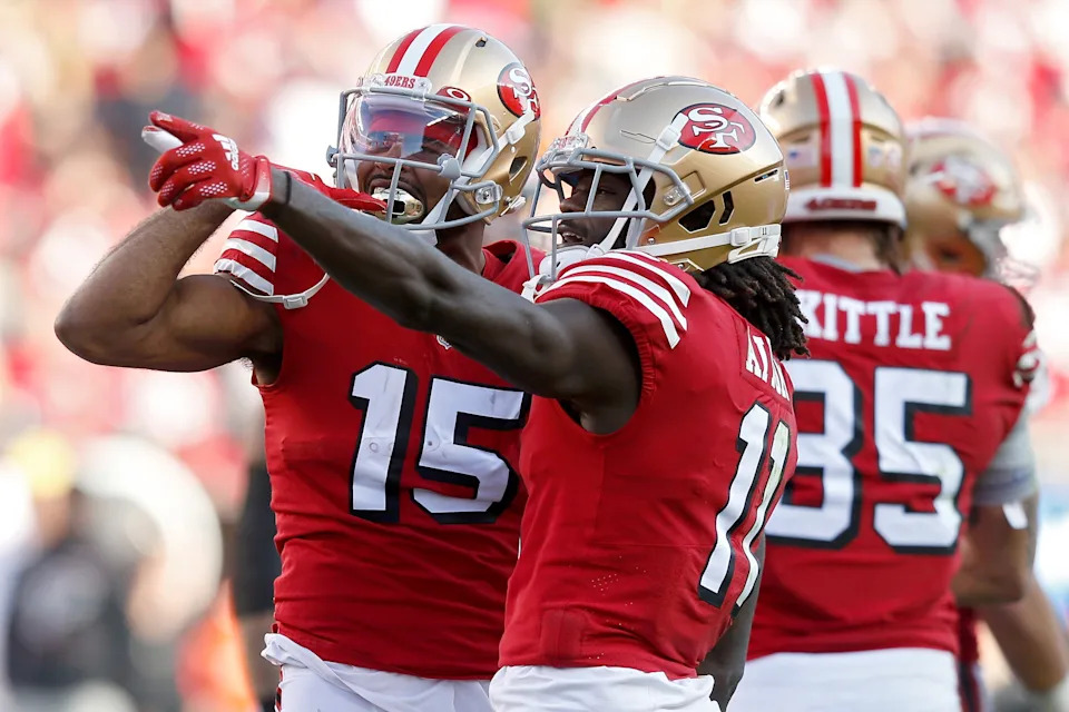 SANTA CLARA, CALIFORNIA - DECEMBER 19: Jauan Jennings #15 and Brandon Aiyuk #11 of the San Francisco 49ers celebrate a first down in the first quarter of the game against the Atlanta Falcons at Levi's Stadium on December 19, 2021 in Santa Clara, California. (Photo by Lachlan Cunningham/Getty Images)