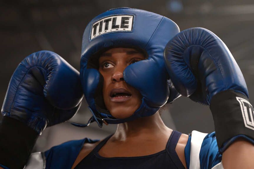 Captain Renee Curry holding up boxing gloves in Law and Order: Special Victims Unit Season 27 Episode 14.