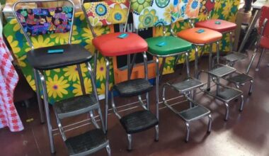 stepstool-style 1960s kitchen chairs with psychedelic vinyl backs.