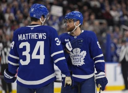 Dec 8, 2025; Toronto, Ontario, CAN; Toronto Maple Leafs forward William Nylander (88) and forward Auston Matthews (34) discuss a play against the Tampa Bay Lightning during the first period at Scotiabank Arena. Mandatory Credit: John E. Sokolowski-Imagn Images