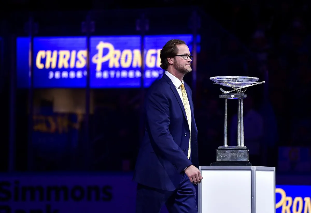 Former St. Louis Blues defenseman Chris Pronger (44) walks past The Presidents Cup Trophy after his jersey is retired and raised to the rafters prior to a game between the St. Louis Blues and the Nashville Predators at Enterprise Center.
