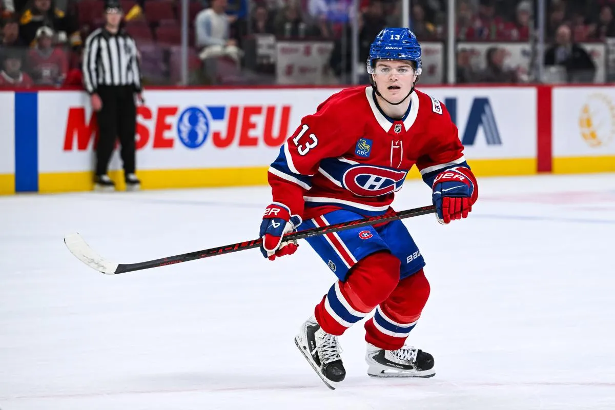 Montreal Canadiens right wing Cole Caufield (13) skates against the Boston Bruins during overtime at Bell Centre.