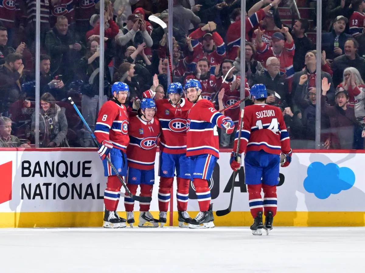 Montreal Canadiens forward Juraj Slafkovsky (20) celebrates with teammates after scoring a goal against the Carolina Hurricanes during the second period at the Bell Centre.