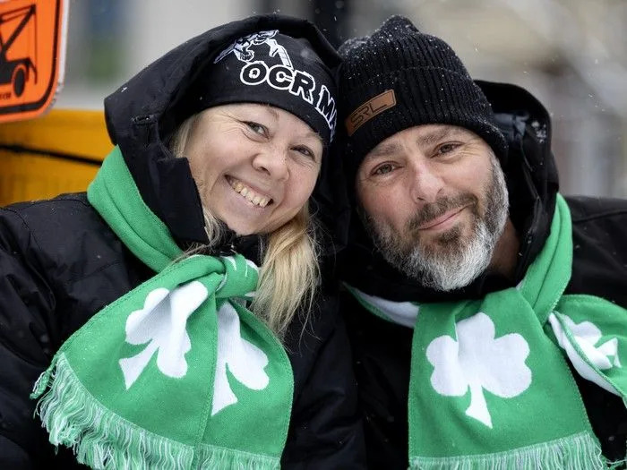  Spectators brave the steady snowfall to watch the St. Patrick’s Parade in Montreal on Sunday, March 22, 2026.