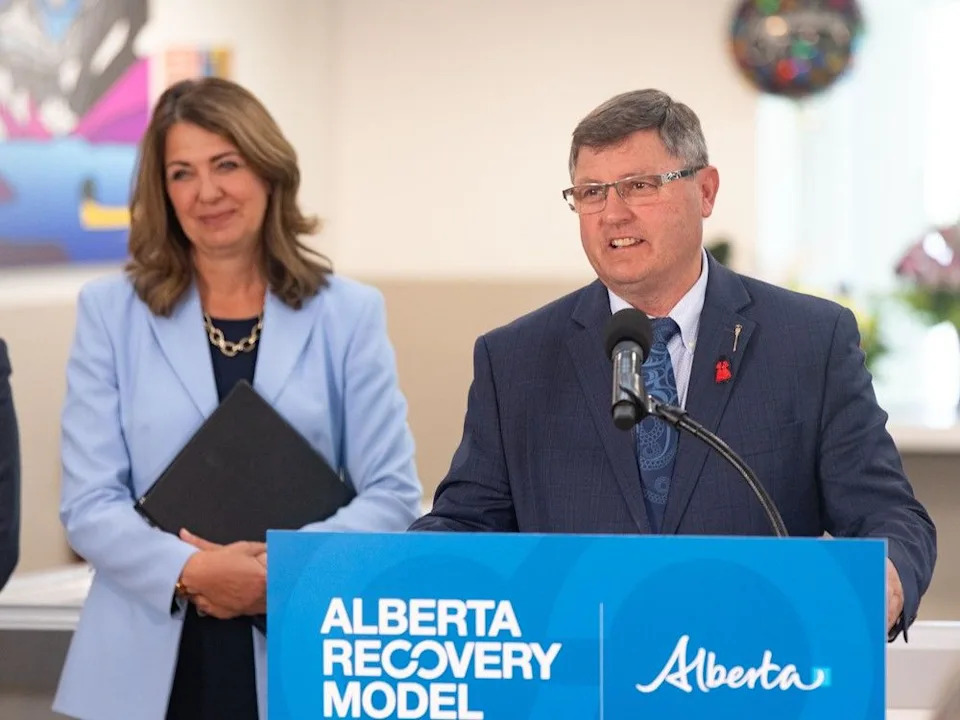  Alberta Mental Health and Addiction Minister Rick Wilson speaks alongside Premier Danielle Smith for the grand opening of a recovery community in Calgary on Aug. 21, 2025.
