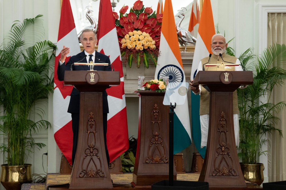 Indian Prime Minister Narendra Modi looks on as Prime Minister Mark Carney delivers remarks following the presentation of agreements and joint statements in New Delhi, India, Monday, March 2, 2026. THE CANADIAN PRESS/Adrian Wyld
