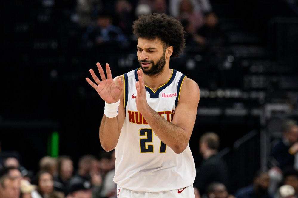 Denver Nuggets guard Jamal Murray reacts to making a 3-point basket during the first half of an NBA basketball game against the Utah Jazz, Monday, March 2, 2026, in Salt Lake City. (AP Photo/Tyler Tate)